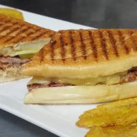 Cuban Sandwich · Juicy and tender roast pork, ham, swiss cheese, pickles and mustard on a crunchy Italian hero.