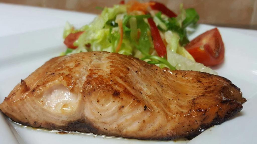 Grilled Salmon / Salmon Parilla · A fillet of salmon flat iron cooked simply with salt, pepper and a splash of lime.