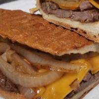 Steak And Onion Sandwich / Bistec Enc. · Juicy and flavorful sirloin strips of steak sauteed in caramelized onions served on an Itali...