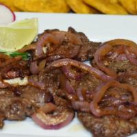 Sirloin Steak Fillet And Onions / Bistec Encebollado · A fillet of tender Sirloin steak slowly cooked to perfection topped with onions.