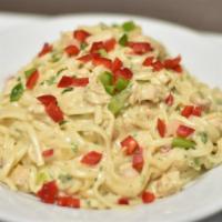 Chicken Alfredo Pasta / Pasto Pollo Alfredo · A flavorful and juicy chicken breast in a freshly made fettuccine alfredo pasta topped with ...