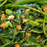 Watercress With Preserved Bean Curd Sauce · Over Rice.