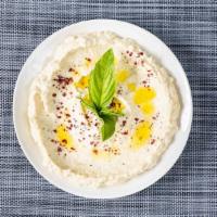 Hummus · Puréed chickpeas blended with tahini, garlic & olive oil.