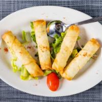 Cigar Borek · Pan fried phyllo rolls, stuffed with feta cheese and parsley.