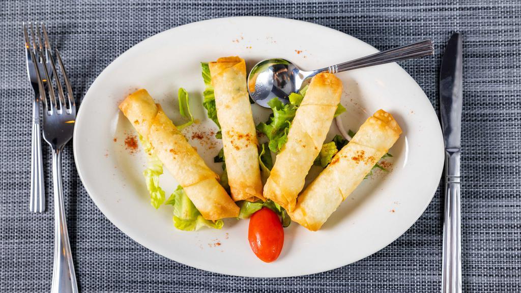 Cigar Borek · Pan fried phyllo rolls, stuffed with feta cheese and parsley.