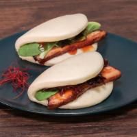 Chashu Buns · Soy braised pork belly served over a soft steamed bun and house made sauce.