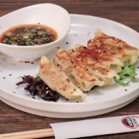 Gyoza · Pan-fried pork or vegetable, Infused soy dipping sauce.