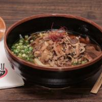 Sukiyaki Udon · Soy dashi broth, marinated shaved beef, caramelized onions, scallions, and sweet mushrooms.