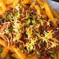 Chili Cheese Fries · Hearty chili and creamy cheese loaded onto golden French fries.