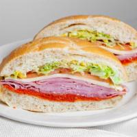 Italian Sandwich · Deluxe ham, pepperoni, Genoa salami, Provolone cheese, lettuce, tomato, onion, oil and vineg...