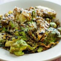 Crispy Fried Brussels Sprouts · Vegetarian. Topped with shredded parmesan, capers and a balsamic glaze drizzle.