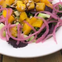 Fresh Mango Mixed Salad · Sliced mango, mixed greens, toasted sunflower seeds, cucumber, red onion with olive oil and ...