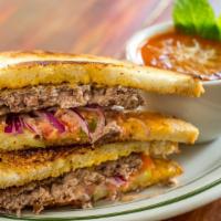 Grass-Fed Burger Melt · Topped with aged vermont cheddar cheese, plum tomatoes, red onions, dill pickles, and specia...