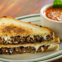 Cheesy Portobello Sandwich · Vegetarian. Sauteed balsamic portobello mushrooms, caramelized onion, fresh mozzarella on pr...
