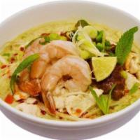 Penang White Curry Laksa 勇记白咖喱汤面 · Spicy. Yellow egg noodles and rice vermicelli, roasted chili paste and bean sprouts in aroma...