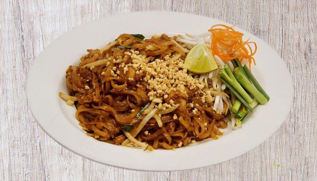 Pad Thai 北泰 · Spicy. Flat rice noodles, egg, tofu, bean sprouts, chives, crushed peanuts and lime wedge.