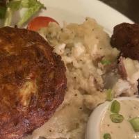 Crab Cakes · fresh lump crab meat made with garden vegetables  and golden fried . served with mashed pota...