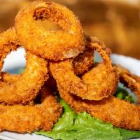 Extra Large Homemade Hand Battered Onion Rings · Popular, vegan, and vegetarian. Served with our Maui burgers smokey dipping sauce.