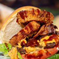 Upcountry Roundup Bbq Bacon Burger · House-made guava bbq sauce and a large Maui onion ring with cheddar cheese and a blanket of ...