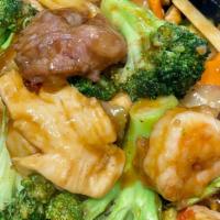 Happy Family · Combination of shrimp, lobster meat, chicken, beef, and pork sauteed with vegetable in chef'...