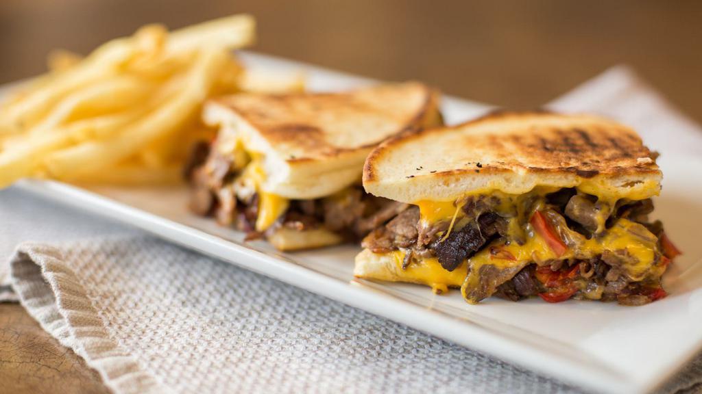 Philly Steak Panini · Roasted peppers, onions and American cheese.