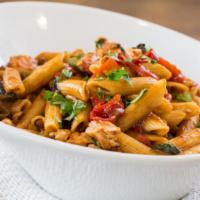 Penne Christina · Diced chicken breast with mushrooms, onions, red peppers, basil and penne pasta, tossed in a...
