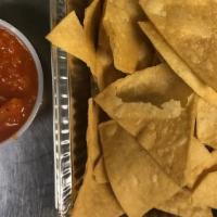 Chips & Kimchi Salsa · House-made chips and signature kimchi salsa; two sizes - medium 4oz & large 8oz