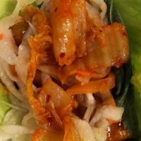 Ssam Taco(S) · Wrapped in sesame and green leaf lettuce, white rice, cucumber kimchi, white kimchi, scallio...