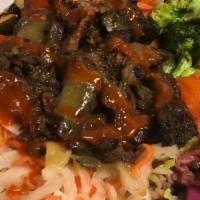 Korean Bbq Beef Short Rib Bowl · Served on a bed of rice and greens topped with fresh traditional kimchi, pickled daikon, roa...