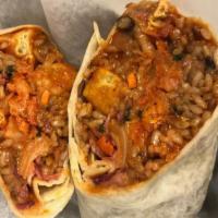 Korean Spicy Tofu Burrito · Tossed in Korean pepper paste “gochujang”, agave nectar, toasted sesame seed glaze topped wi...