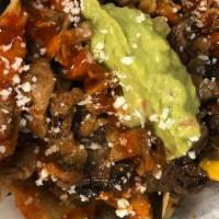 Korean Bbq Nachos · Marinated Korean BBQ beef and spicy seared pork with queso blanco, cheddar, black beans and ...