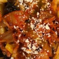 Kimchi Fries · Loaded with cheddar, queso blanco, kimchi chipotle aioli and kimchi salsa. The Kimchi Fries ...
