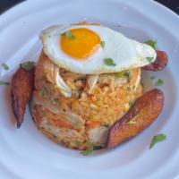 Arroz Con Pollo  · Chicken fried rice sauteed with sweet corn, carrots, scallions, and cilantro. Fried egg. Swe...