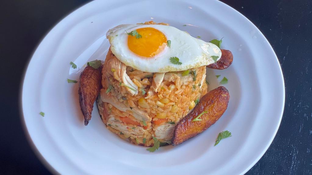 Arroz Con Pollo · Chicken fried rice sauteed with sweet corn, carrots, scallions, and cilantro. Fried egg. Sweet plantains.