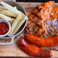 Parrillada Loca · Grilled steak, chicken, pork chop and chorizo. Choice of 2 sides