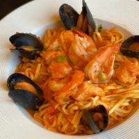 Seafood Noodles · Mussels, fish and shrimp in tomato and butter sauce.