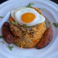 Arroz Con Chancho · Pork fried rice sauteed with sweet corn, carrots, scallions and cilantro. Fried egg. Sweet p...