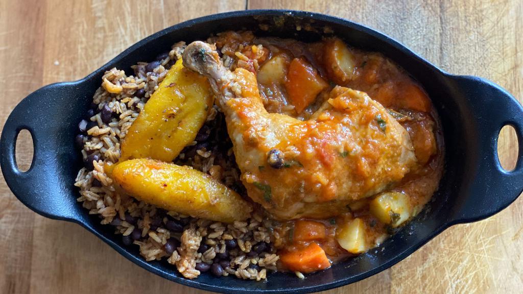 Chicken Stew · Chicken stew with carrots and potatoes. Yellow rice, black beans and sweet plantains.