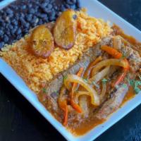 Steak With Onions And Peppers · Sirloin steak, onions, tomato, and cilantro. Rice. Beans. Sweet plantains.