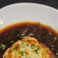 French Onion Soup · Caramelized onions, vegetable stock, toast, cheese.