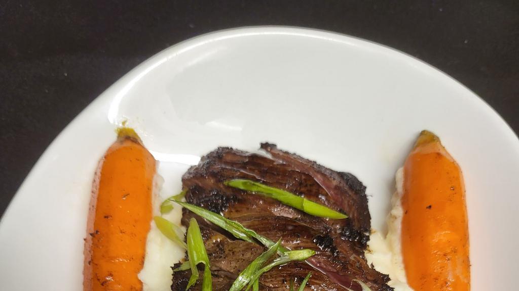 Skirt Steak · Marinated with soy, ginger, and sesame oil, grilled to perfection, julienne vegetables.