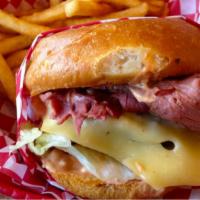 The Pastrami Cheeseburger · Fresh ground beef patty, creamy cheese, and hot savory pastrami with your choice of condimen...