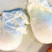 Poached Eggs · 2 eggs any style home fries or grits and toast.