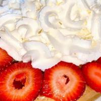 Waffles & Strawberries And Whipped Cream · Fresh strawberries and whipped cream.