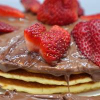 The Nutella Pancakes · Topped with Nutella and strawberries