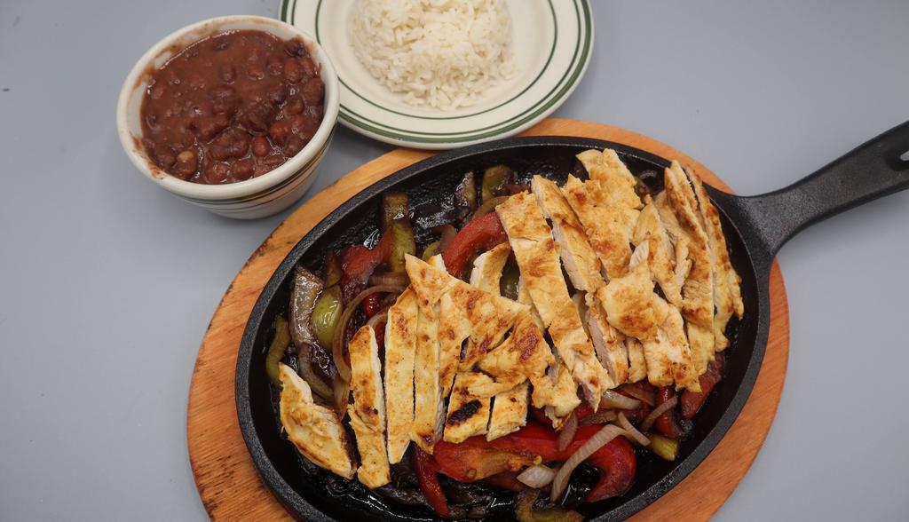 Sizzling Chicken Fajita · Onions, tomato's and bell peppers.  Side of tortillas