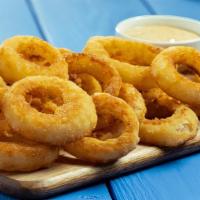 Bright Buoy Onion Rings · Battered and crispy with a side of chipotle sauce for a zip of flavor.