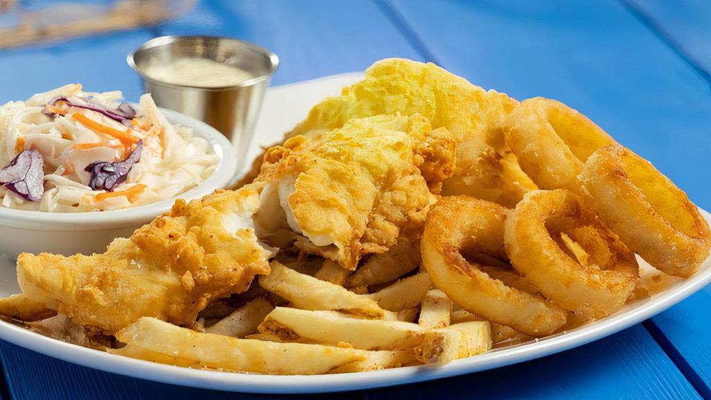 Fish & Chips · A boatload of hand-breaded, crispy fish filets fried nice and crisp until golden brown. Served with seasoned fries, onion rings, coleslaw and tartar sauce.