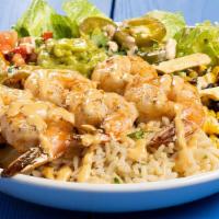 Southwest Shrimp Bowl · Holy moly, this also has guacamole! Seasoned shrimp skewers in a bowl of romaine with sautée...