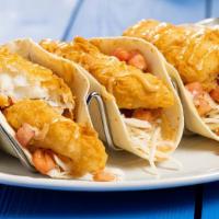Crispy Fish Tacos · Crispy fried fish wrapped in warm flour tortillas with fresh cabbage, fresh pico de gallo an...